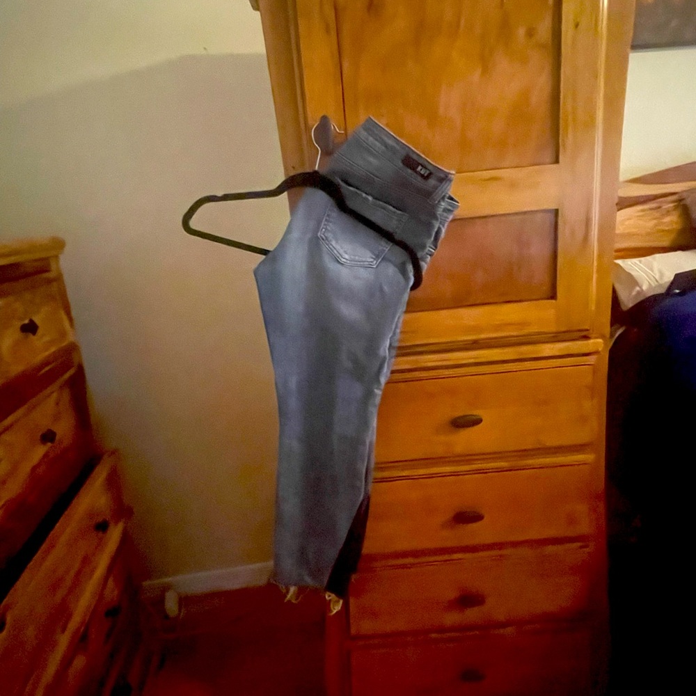 slightly cropped jeans with patched detail at ankle